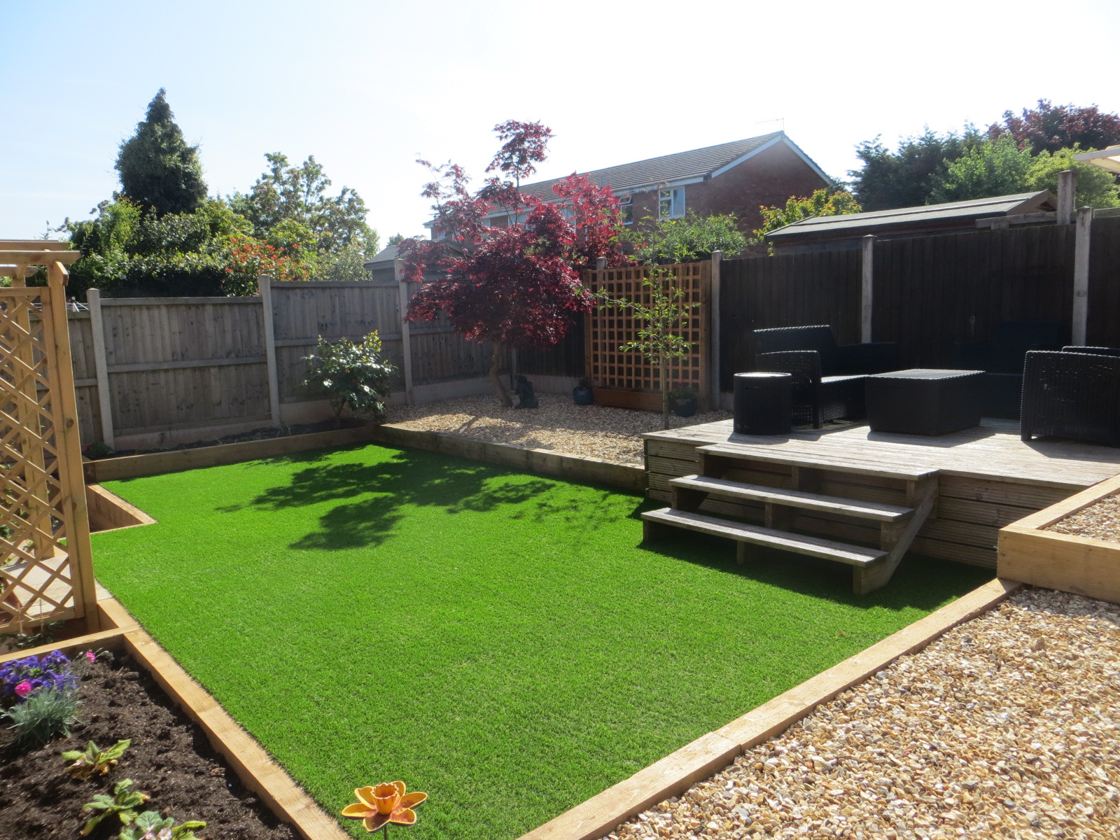 A large low-maintenance front garden with 'Planning-friendly' parking ...